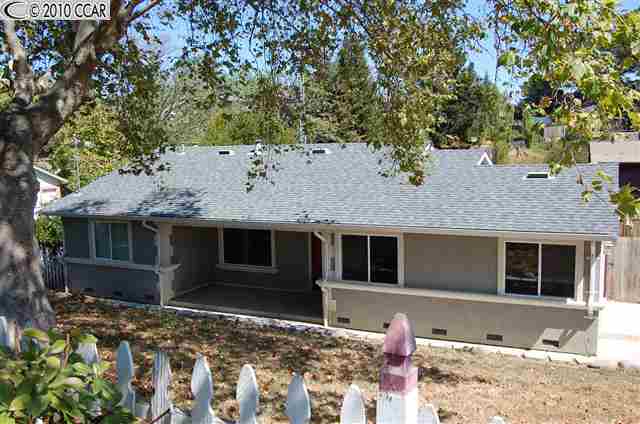 676 Rincon Road El Sobrante, CA 94803 - Photo 1 of 1 a front view of a house with a tree