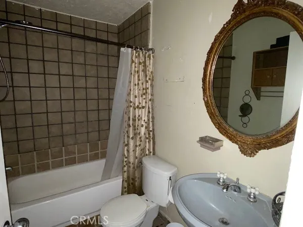 a utility room with a sink dryer and washer