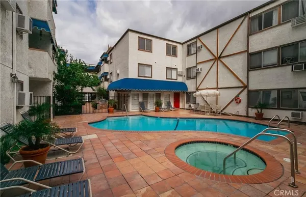 a view of balcony with swimming pool and porch