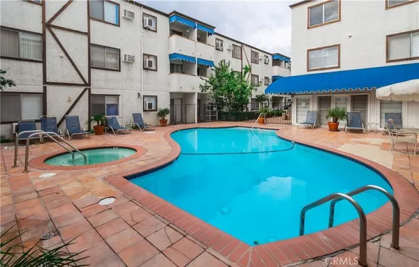 a view of a patio with swimming pool table and chairs