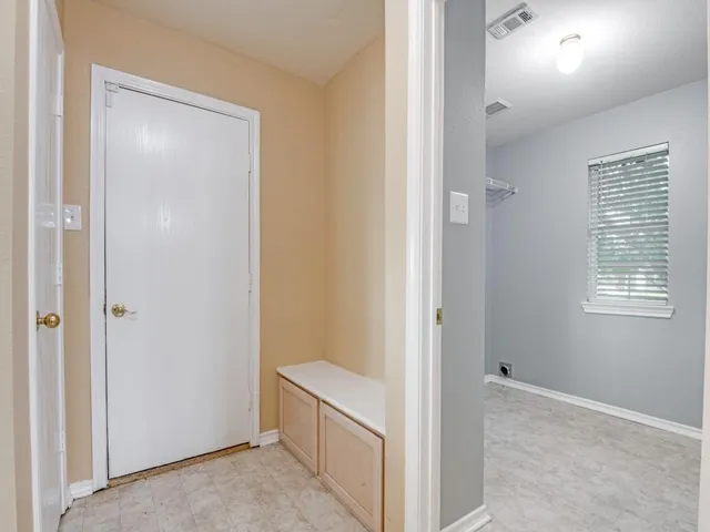 a view of a hallway with closet area