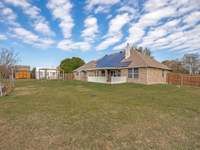 a view of a house with a big yard