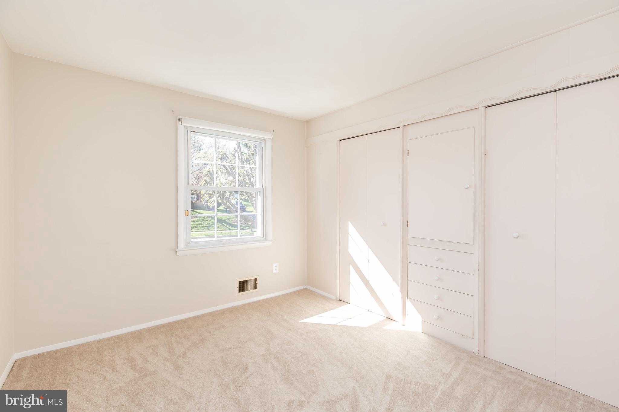 9101 Covered Bridge Road Baltimore, MD 21234 - Photo 19 of 53 Bedroom 1 with natural light and built-in storage