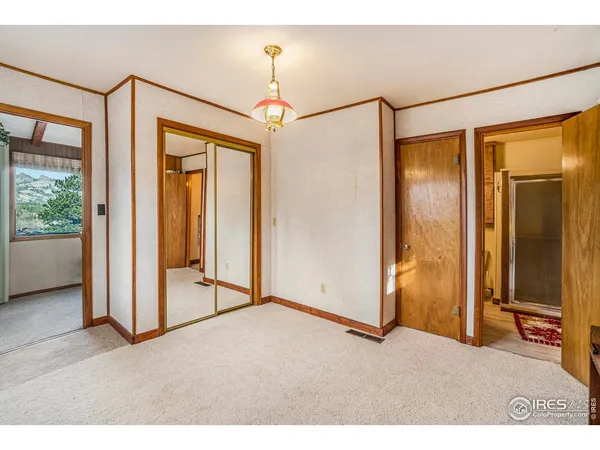 a bathroom with a sink toilet a mirror and shower
