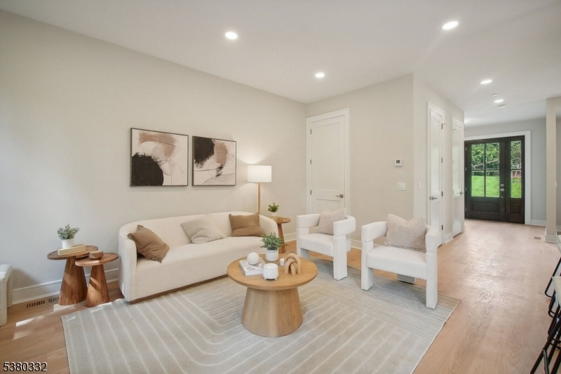 603 Springfield Avenue, Unit 102 Summit, NJ 07901 - Photo 2 of 5 a living room with furniture and white walls