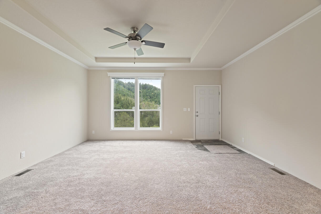 5572 Jumpoff Joe Creek Road Grants Pass, OR 97526 - Photo 11 of 38 a view of an empty room with a window