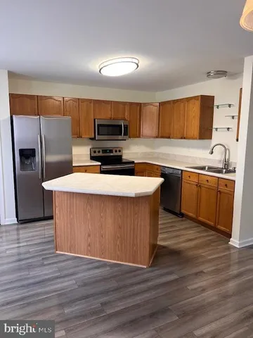 a room with wooden floor and window
