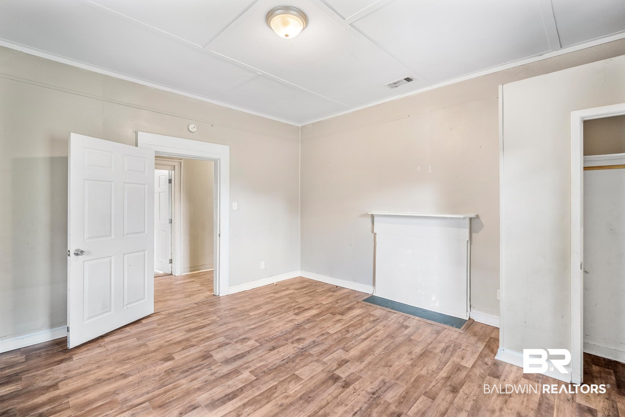 401 Gaston Street Mobile, AL 36603 - Photo 7 of 17 Unfurnished bedroom with a closet and hardwood / wood-style floors