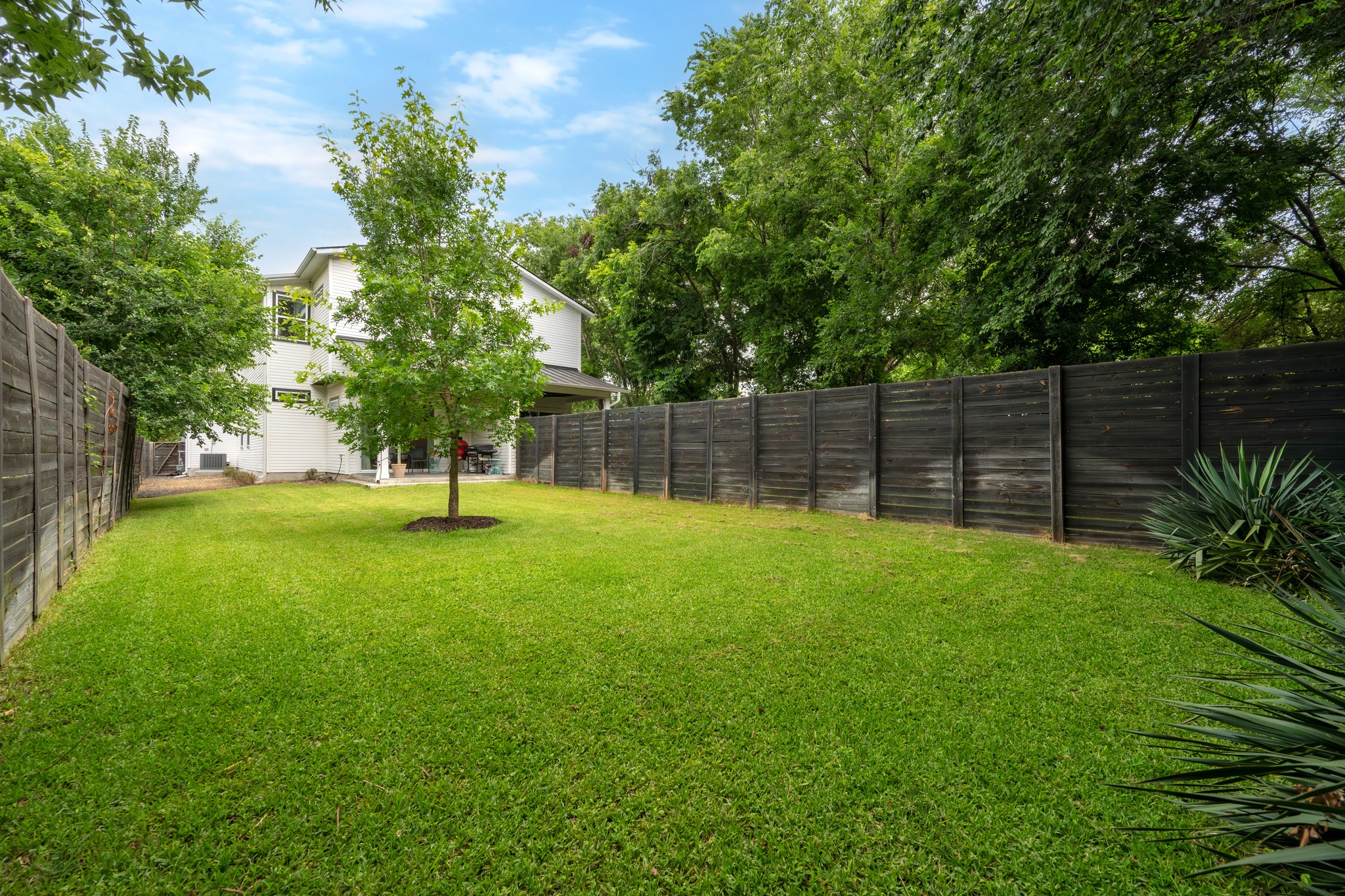 1103 Saucedo Street, Unit 1 Austin, TX 78721 - Photo 40 of 40 A spacious, well-maintained yard provides ample outdoor living space.