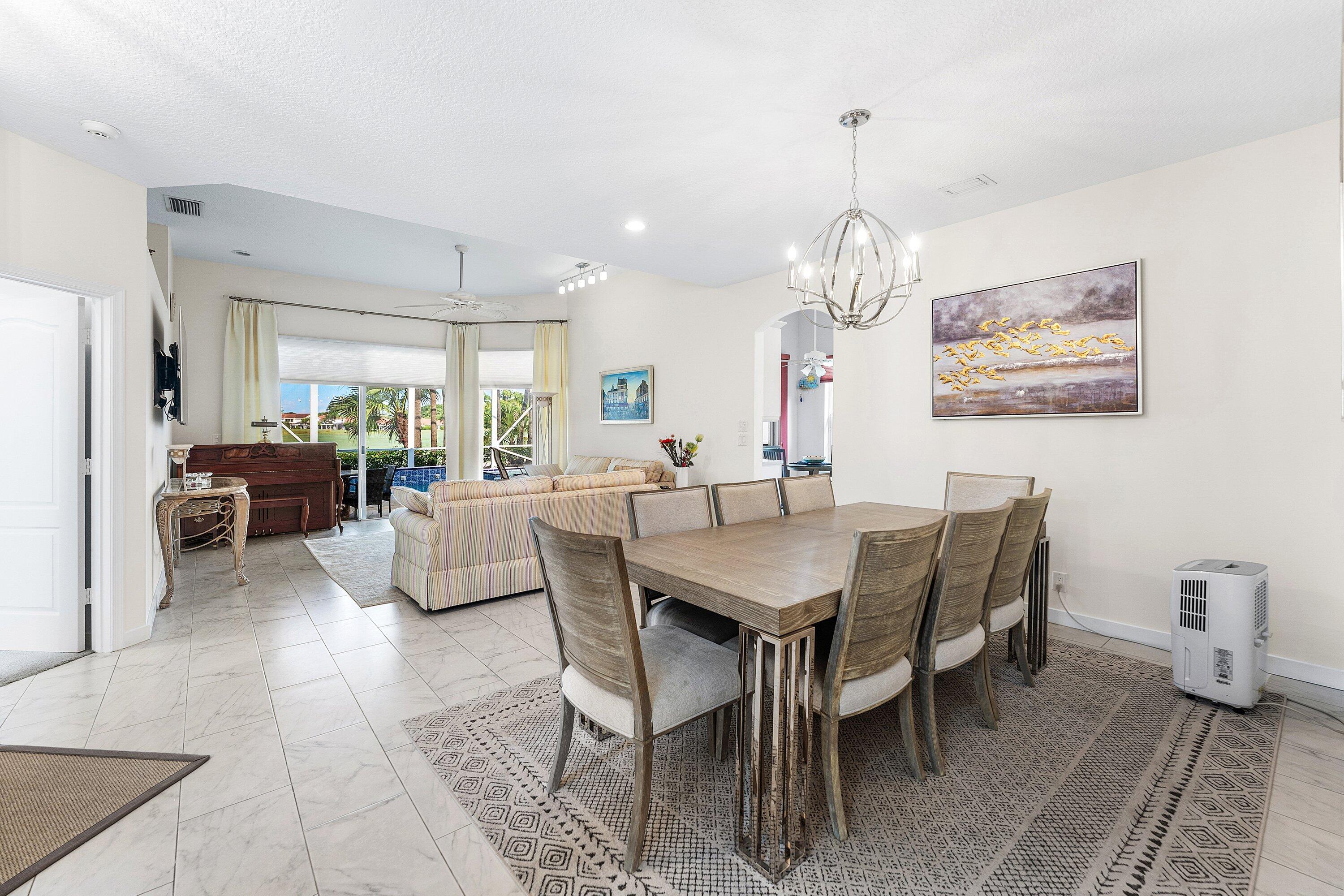 8217 Quail Meadow Way West Palm Beach, FL 33412 - Photo 11 of 38 a view of a dining room with furniture