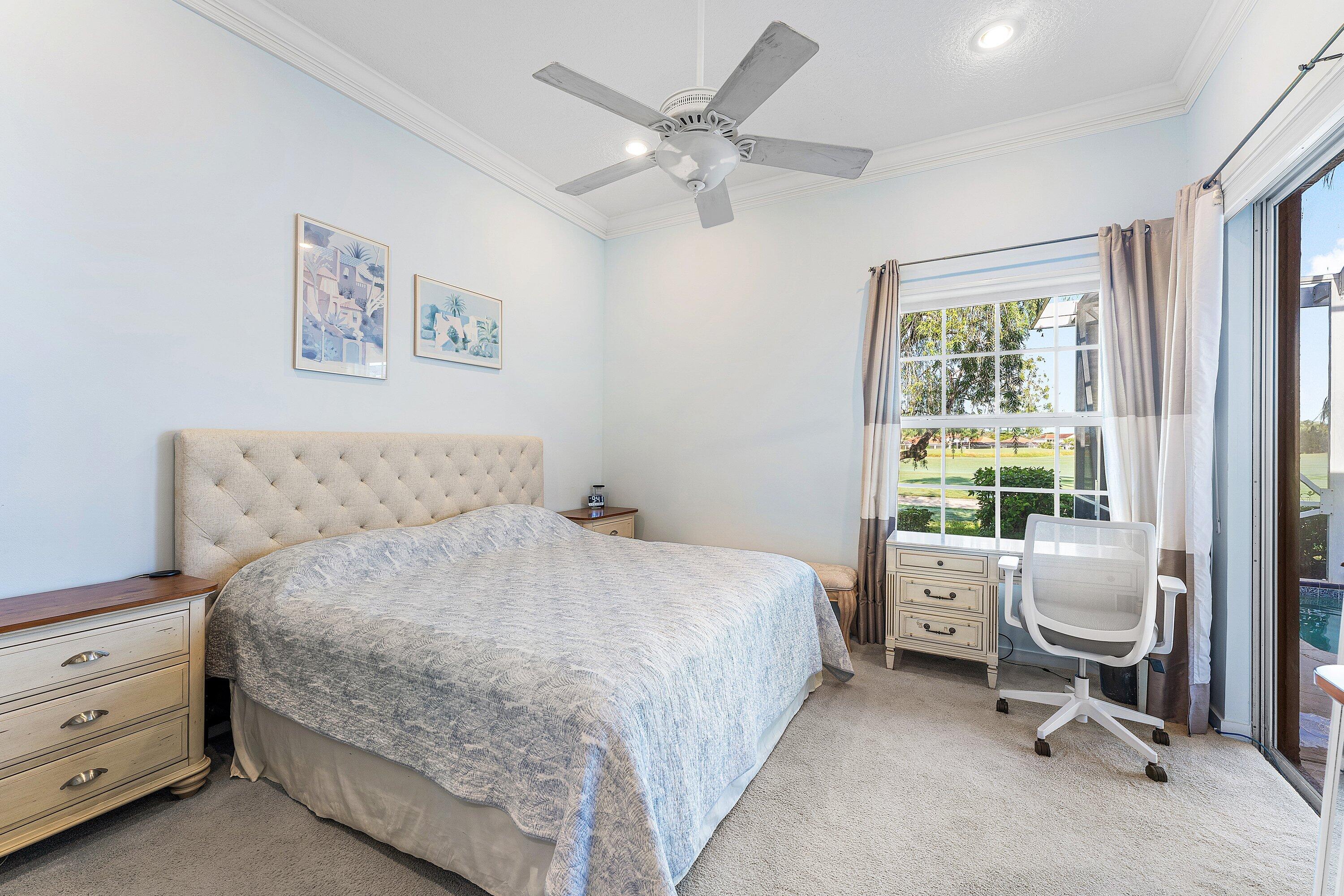 8217 Quail Meadow Way West Palm Beach, FL 33412 - Photo 18 of 38 a bedroom with a bed and a window