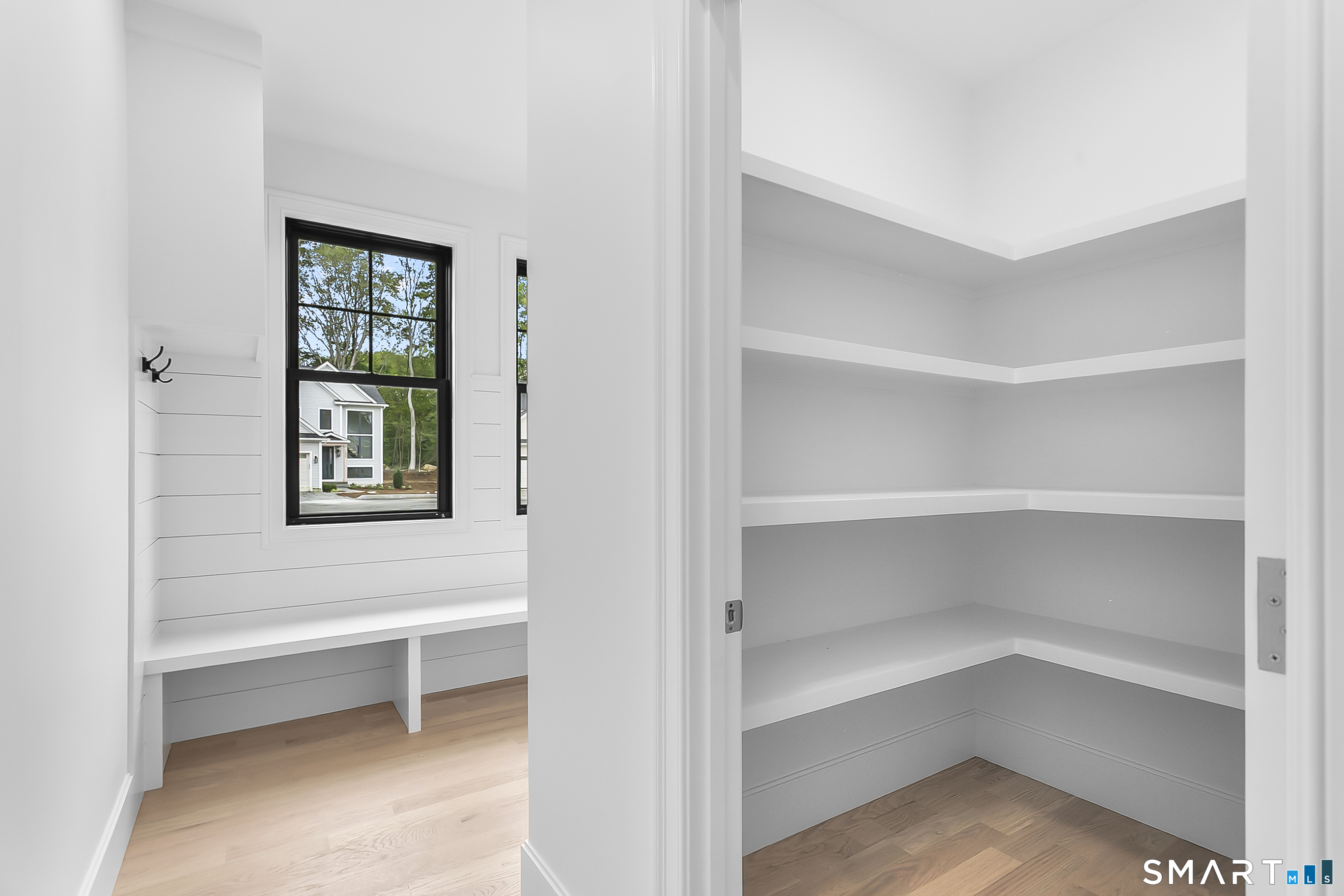 85 Oronoque Hills Road Stratford, CT 06614 - Photo 12 of 37 a view of an empty room with a window and wooden floor