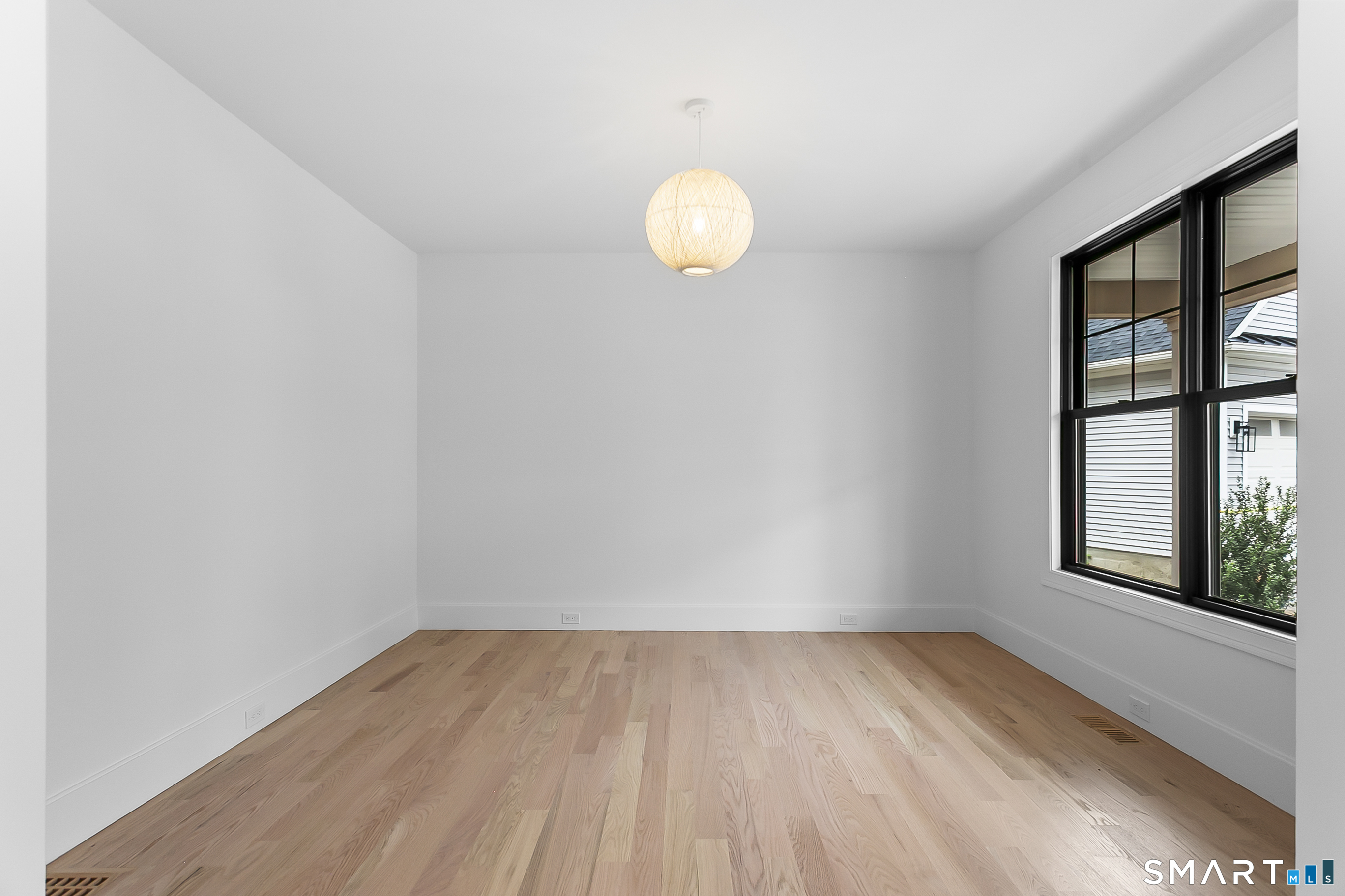 85 Oronoque Hills Road Stratford, CT 06614 - Photo 20 of 37 a view of room with window and wooden floor