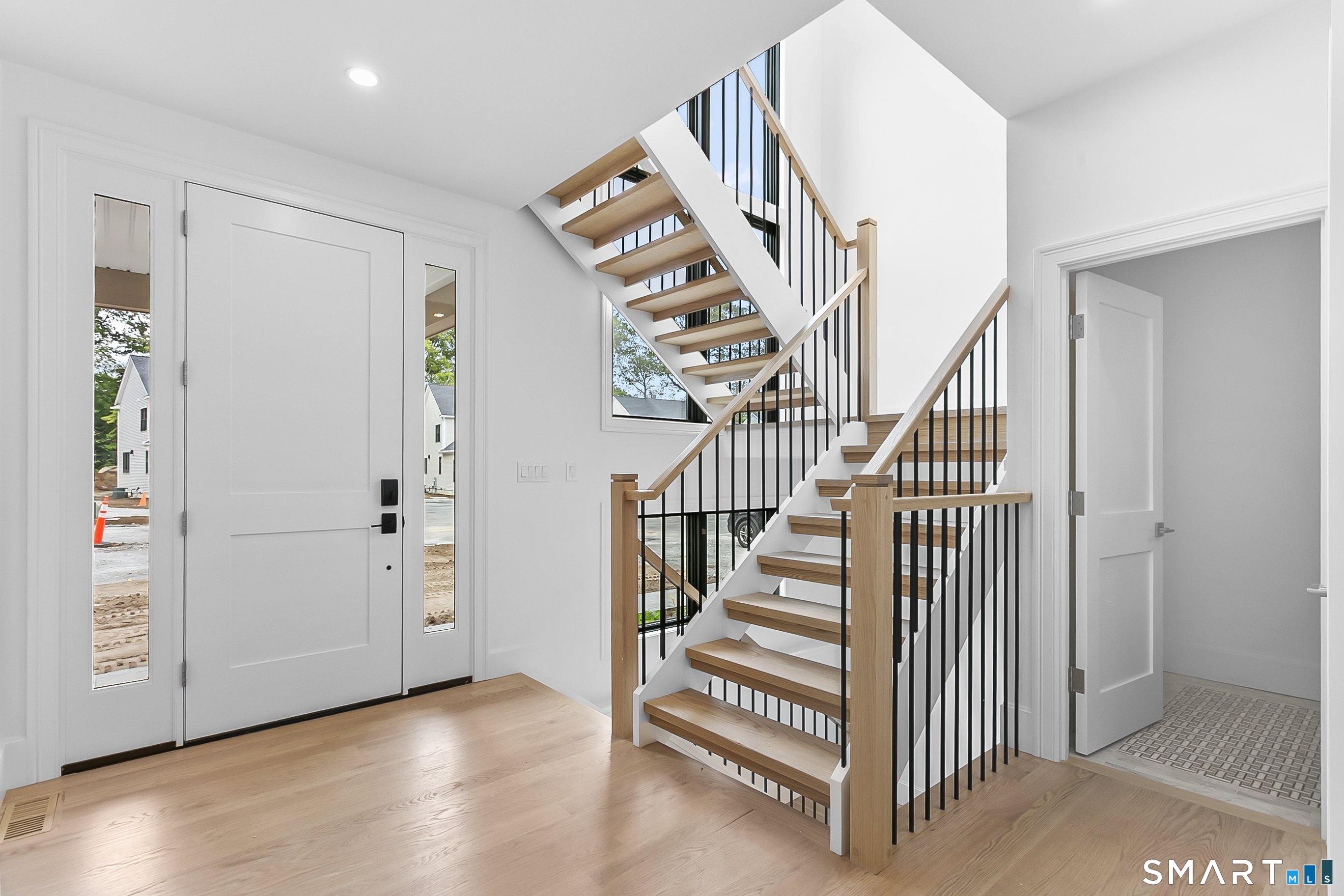 85 Oronoque Hills Road Stratford, CT 06614 - Photo 23 of 37 an entryway with staircase and white walls