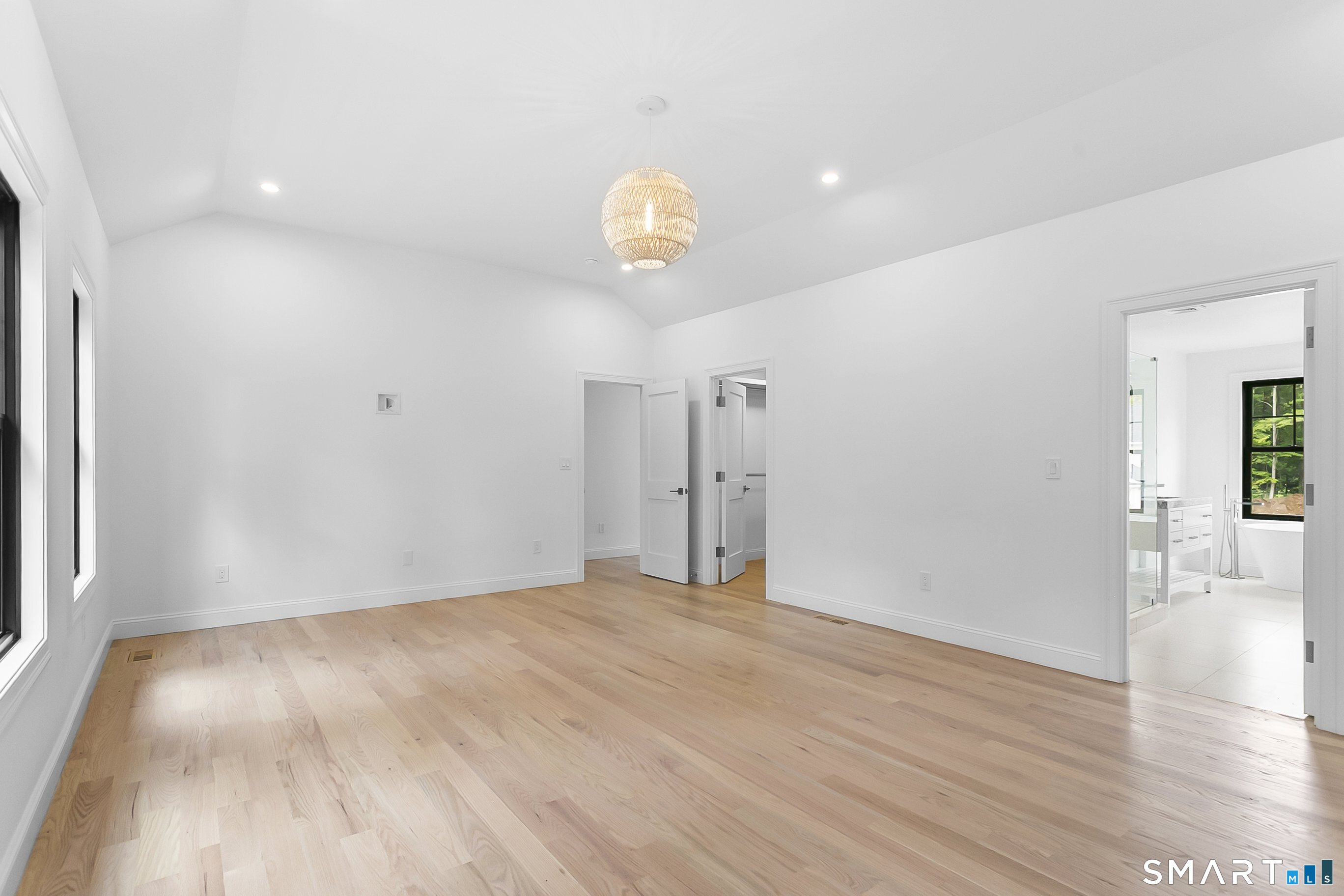 85 Oronoque Hills Road Stratford, CT 06614 - Photo 26 of 37 a view of an empty room with wooden floor and a window