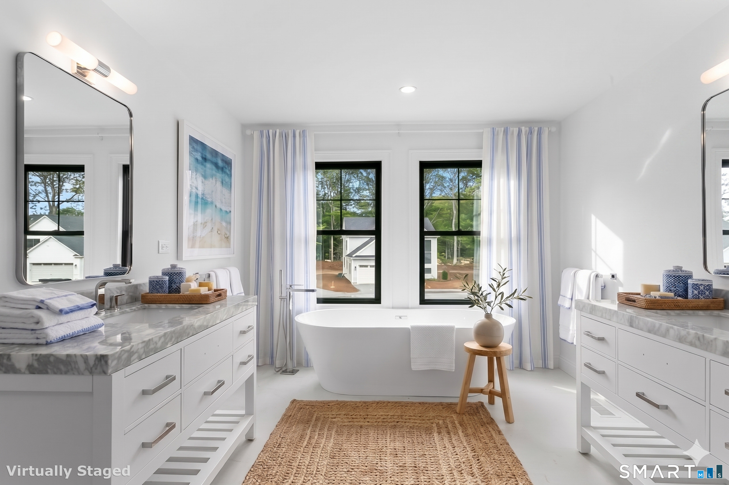85 Oronoque Hills Road Stratford, CT 06614 - Photo 29 of 37 a spacious bathroom with double vanity a large mirror a bathtub and a shower