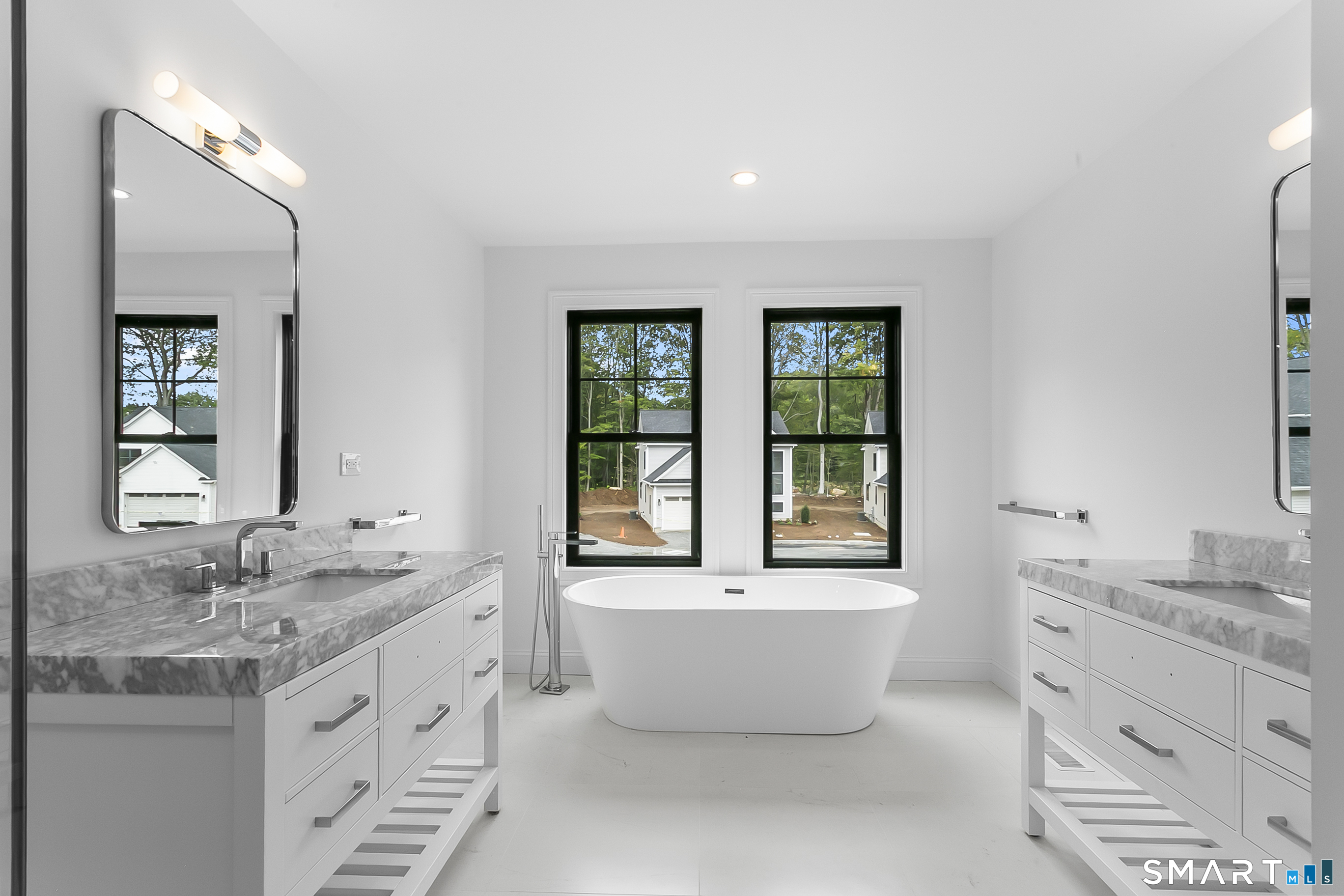 85 Oronoque Hills Road Stratford, CT 06614 - Photo 30 of 37 a spacious bathroom with a double vanity sink mirror and bathtub