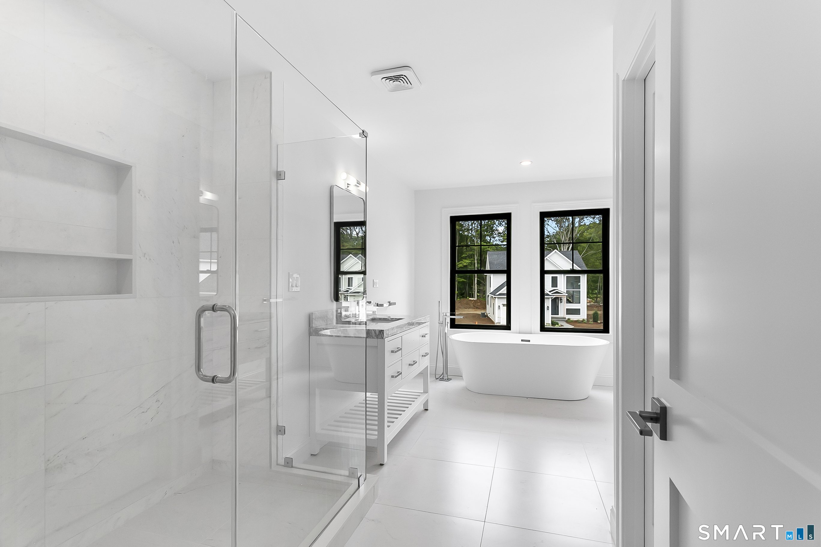 85 Oronoque Hills Road Stratford, CT 06614 - Photo 31 of 37 a bathroom with a glass shower door