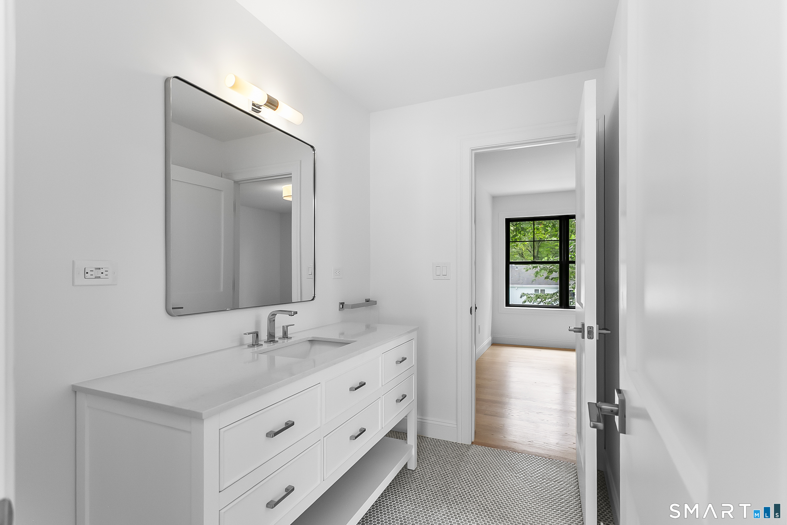 85 Oronoque Hills Road Stratford, CT 06614 - Photo 34 of 37 a bathroom with a double vanity sink and a mirror