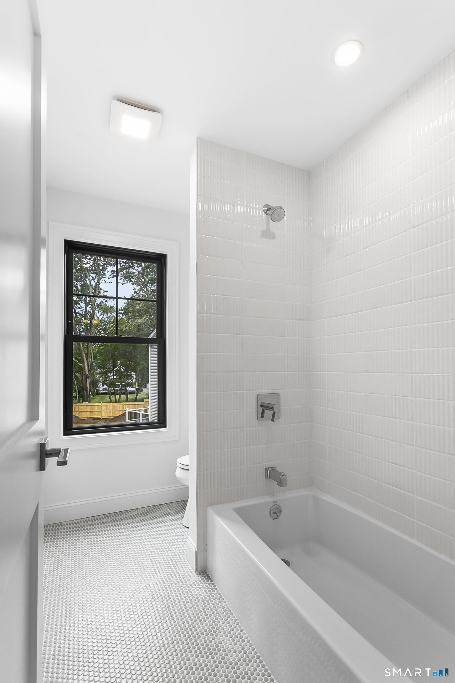 85 Oronoque Hills Road Stratford, CT 06614 - Photo 35 of 37 a bathroom with a granite countertop tub a sink and a window