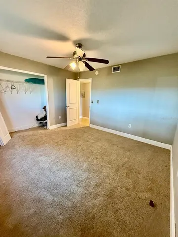 a view of a livingroom with a ceiling fan