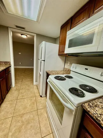 a kitchen with a stove and a microwave