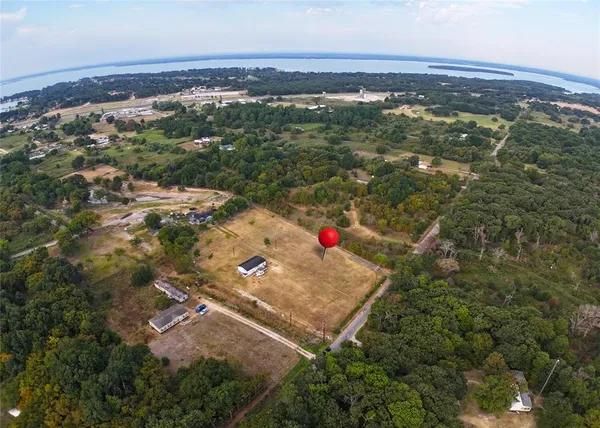 an aerial view of residential house with an outdoor space and seating