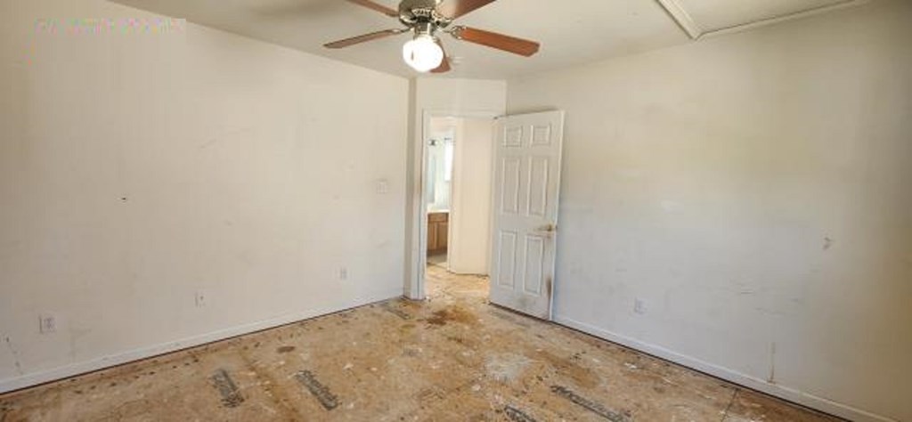 2402 Octopus Road Greenbackville, VA 23356 - Photo 13 of 21 an empty room with a ceiling fan and a window