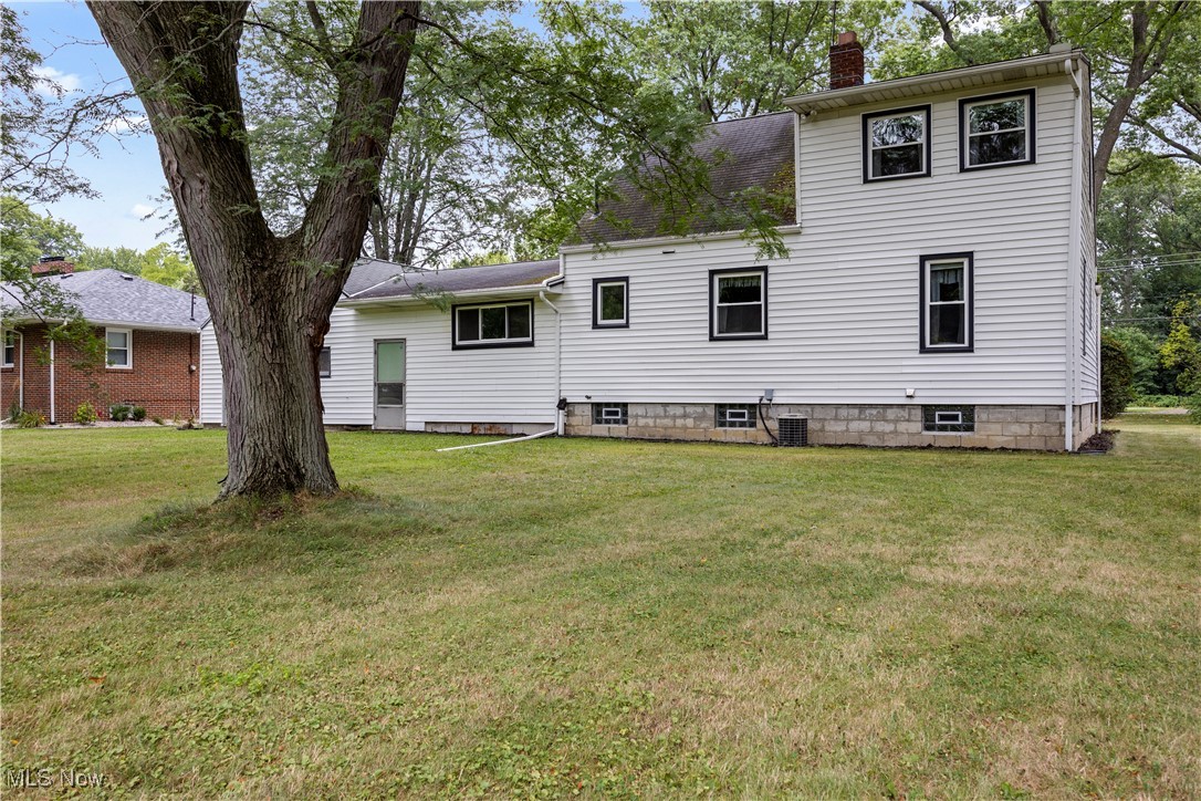 6266 Murray Ridge Road Elyria, OH 44035 - Photo 5 of 36 Rear view of house with a yard