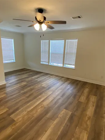 a view of an empty room with empty shelves