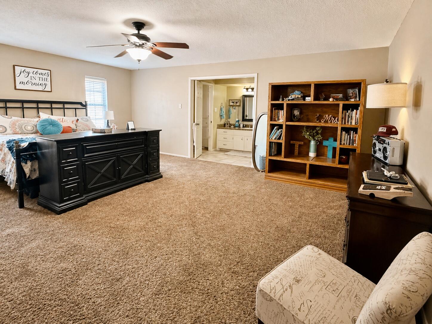 2023 Rice Drive Levelland, TX 79336 - Photo 8 of 15 a living room with furniture and a book shelf