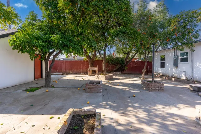 a backyard of a house with lots of green space