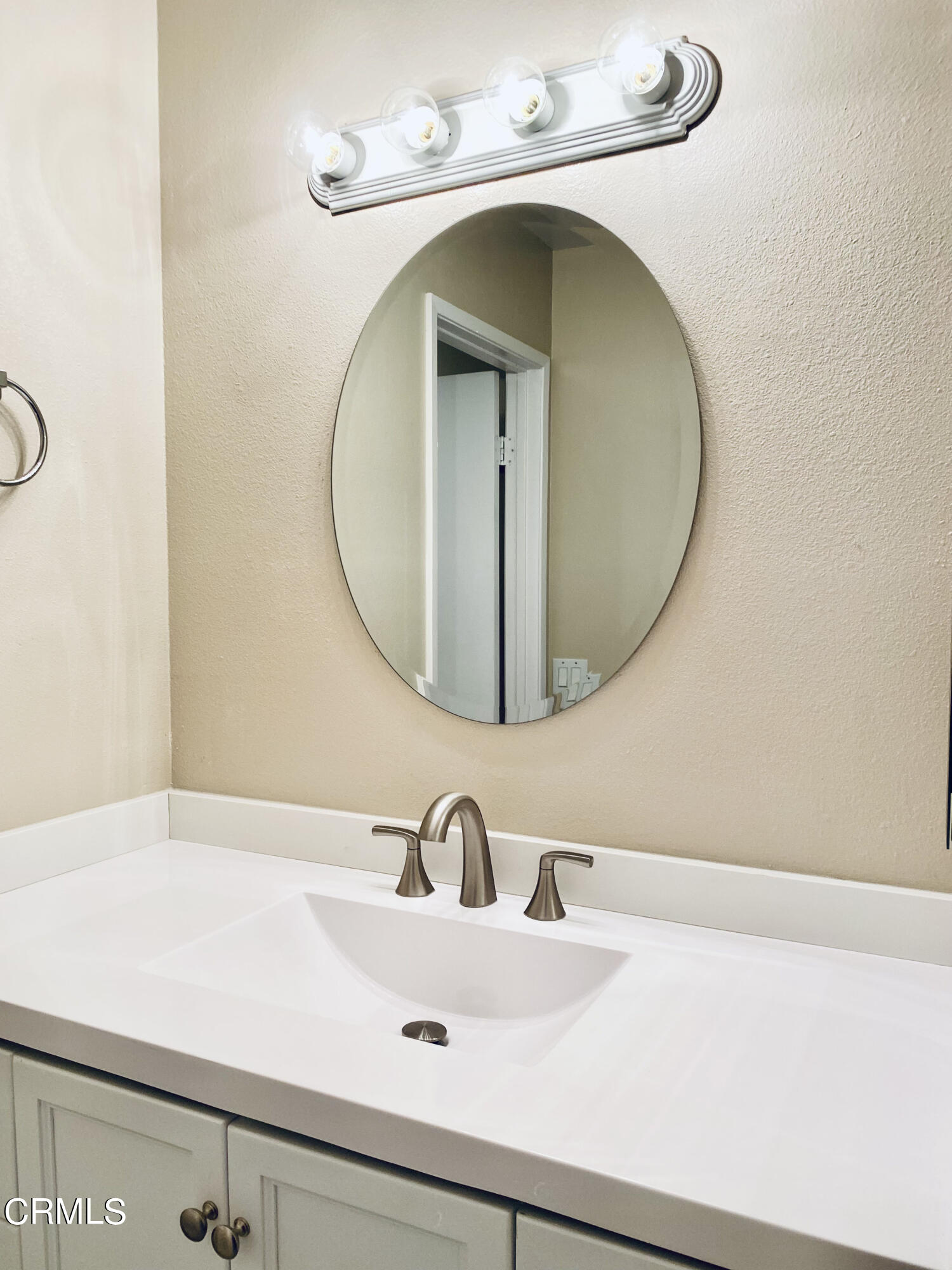 3134 Sunset Lane Oxnard, CA 93035 - Photo 11 of 21 a bathroom with a sink and a mirror