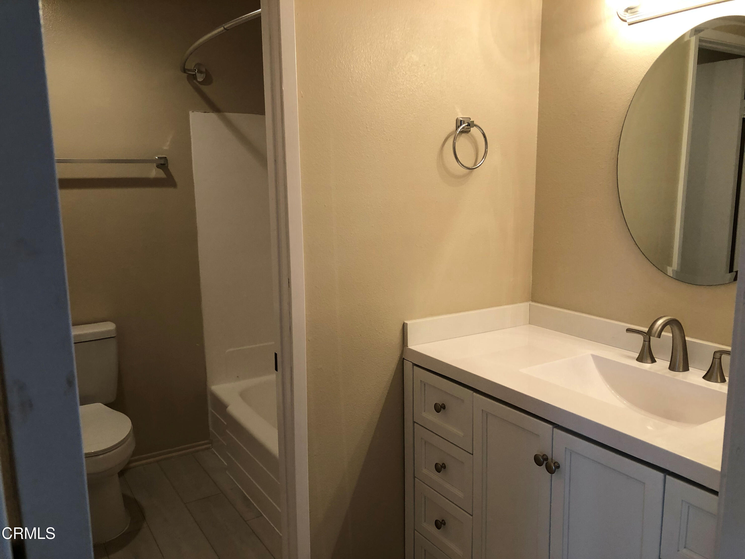 3134 Sunset Lane Oxnard, CA 93035 - Photo 12 of 21 a bathroom with a granite countertop sink toilet and a mirror