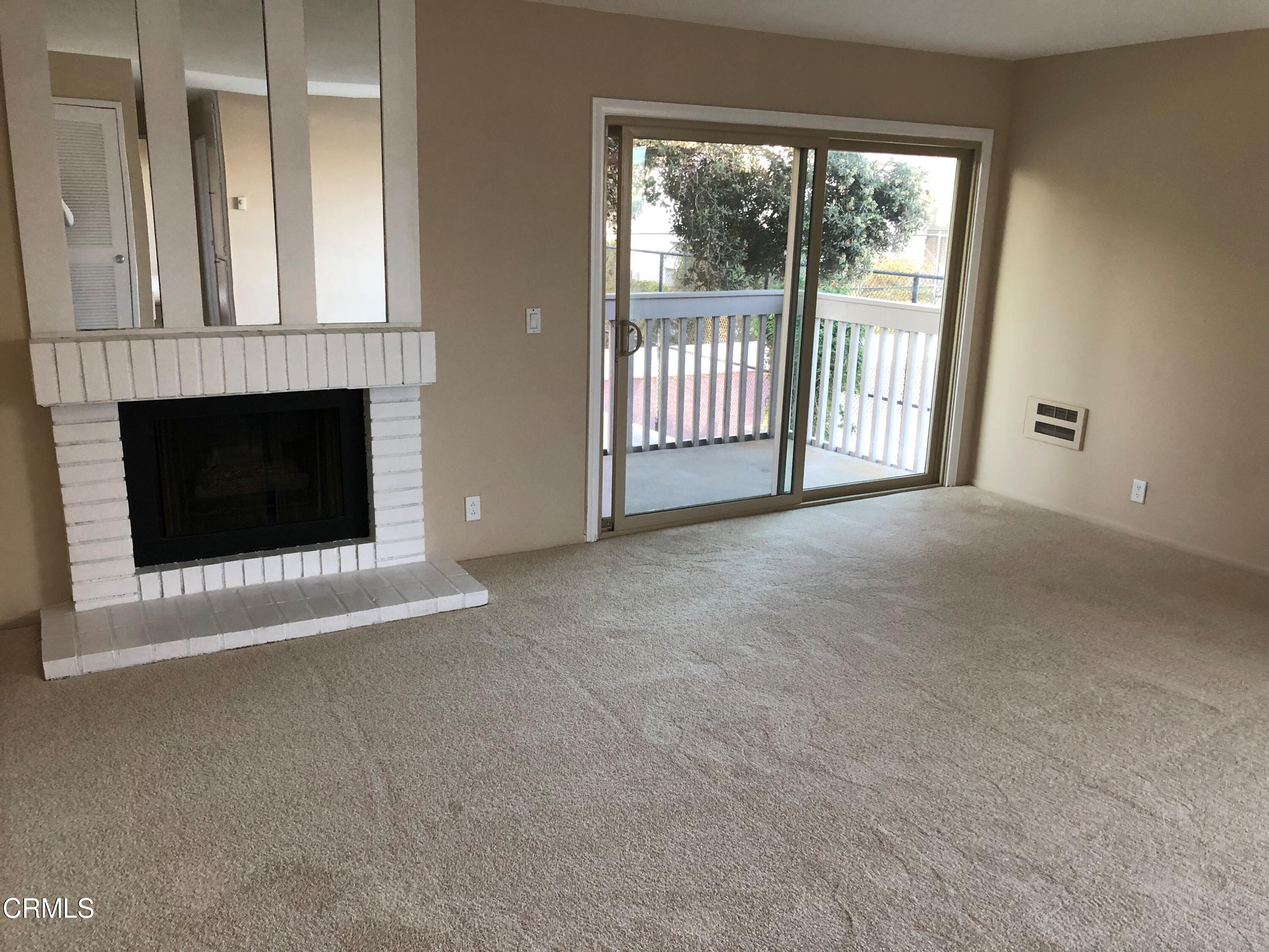 3134 Sunset Lane Oxnard, CA 93035 - Photo 4 of 21 a view of a livingroom with a fireplace and large window