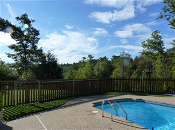 13 Parsons Hill Road Wenham, MA 01984 - Photo 3 of 5 a view of a roof deck with wooden fence