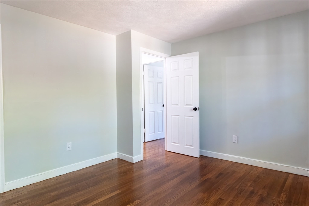 6 Kingsley Road Easton, MA 02356 - Photo 21 of 41 a view of an empty room with wooden floor
