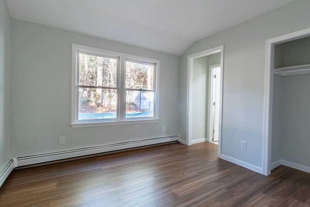 6 Kingsley Road Easton, MA 02356 - Photo 27 of 41 an empty room with wooden floor and windows
