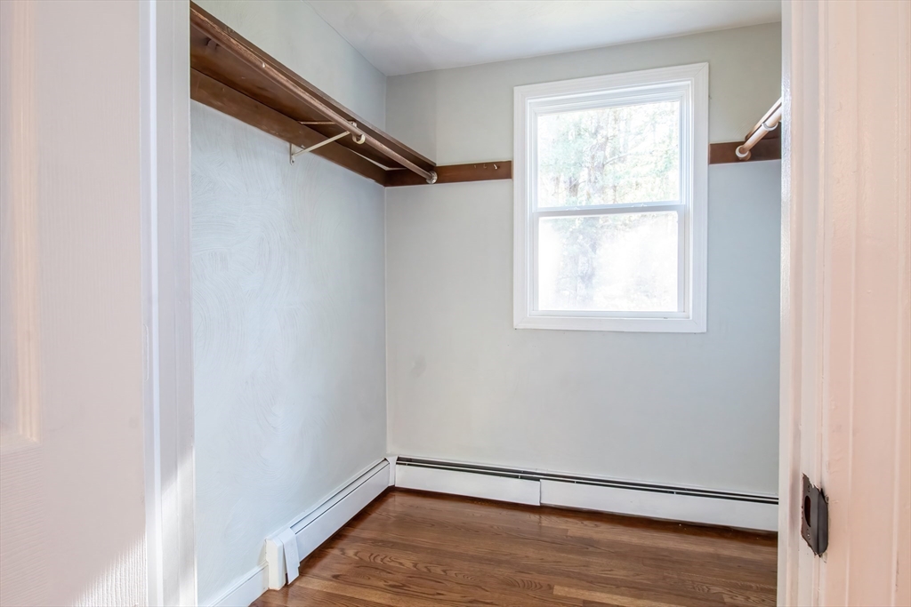 6 Kingsley Road Easton, MA 02356 - Photo 31 of 41 a view of an empty room with wooden floor and a window