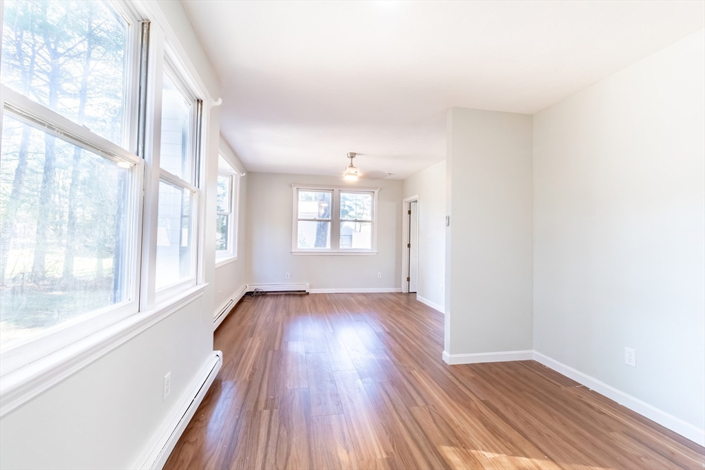 6 Kingsley Road Easton, MA 02356 - Photo 34 of 41 a view of an empty room with wooden floor and a window