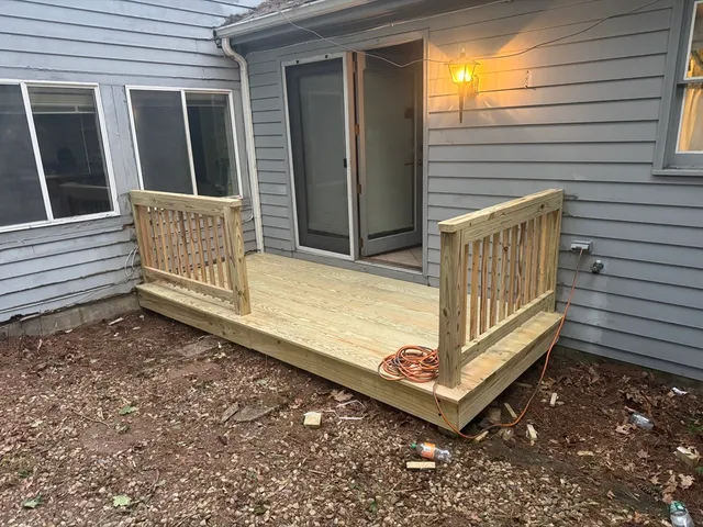 a view of a bench in the backyard