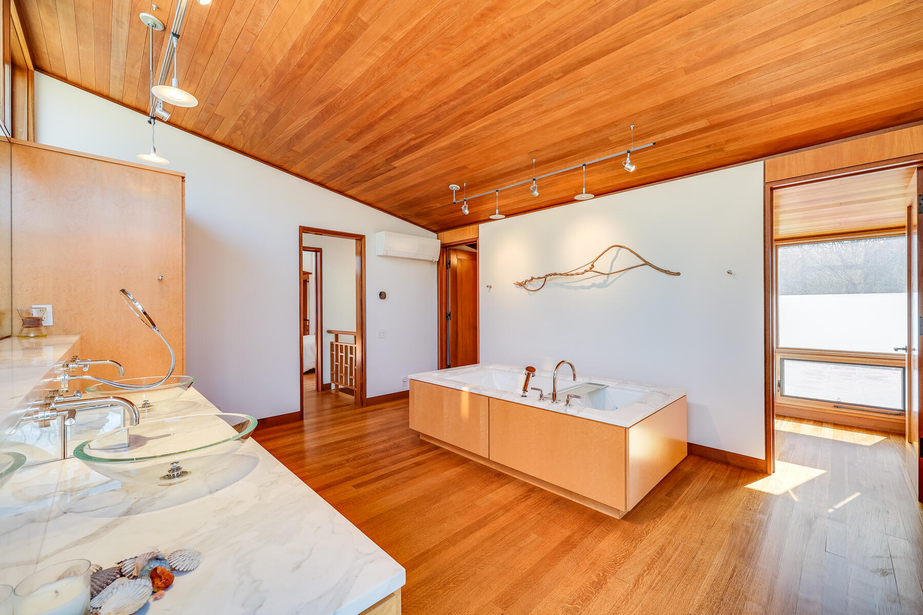 77 Fay Road Falmouth, MA 02543 - Photo 27 of 53 a spacious bedroom with a bed a couch and a window