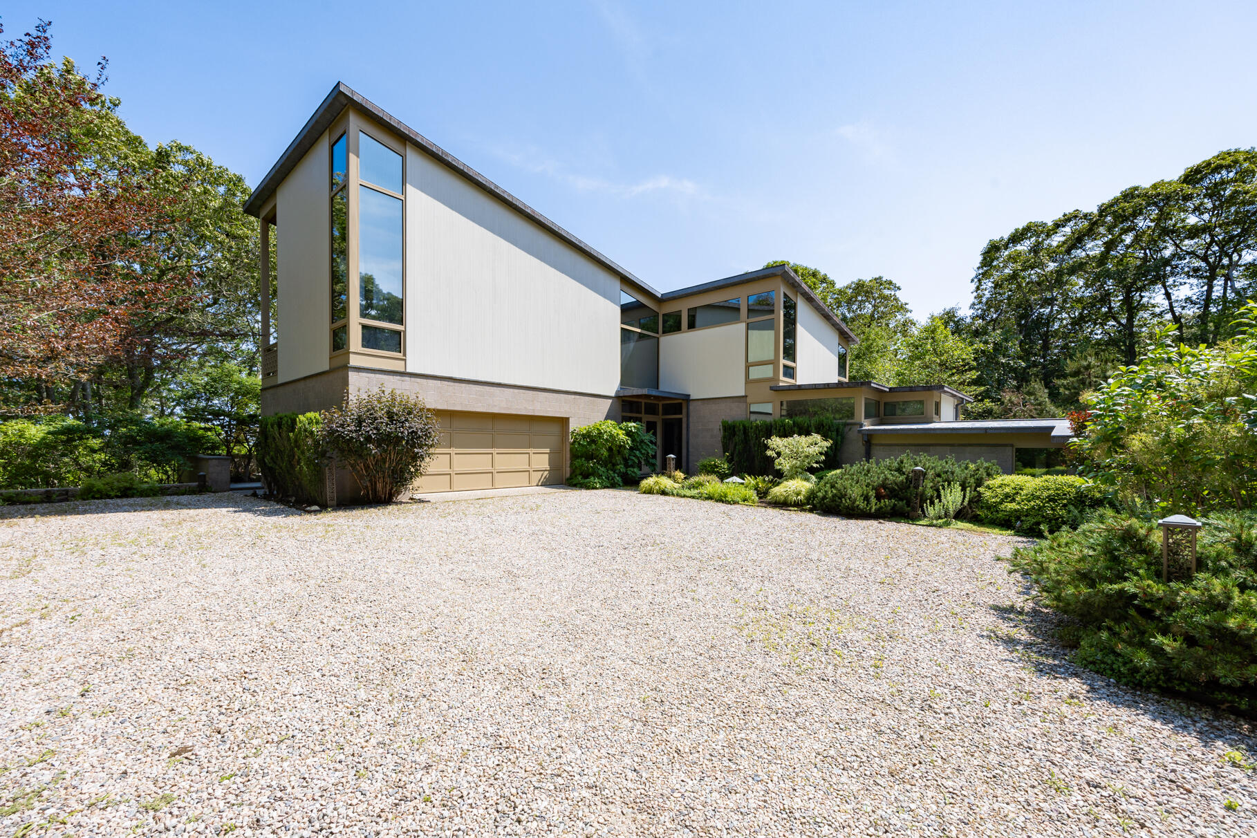 77 Fay Road Falmouth, MA 02543 - Photo 3 of 53 a front view of a house with a yard and a garage