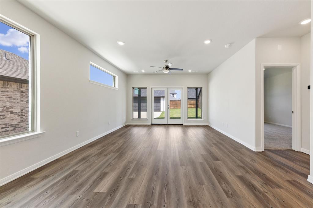 1844 Rosedale Avenue Van Alstyne, TX 75495 - Photo 9 of 26 With a wall of windows looking out to your back yard, this family room offers a warm and inviting place to gather.