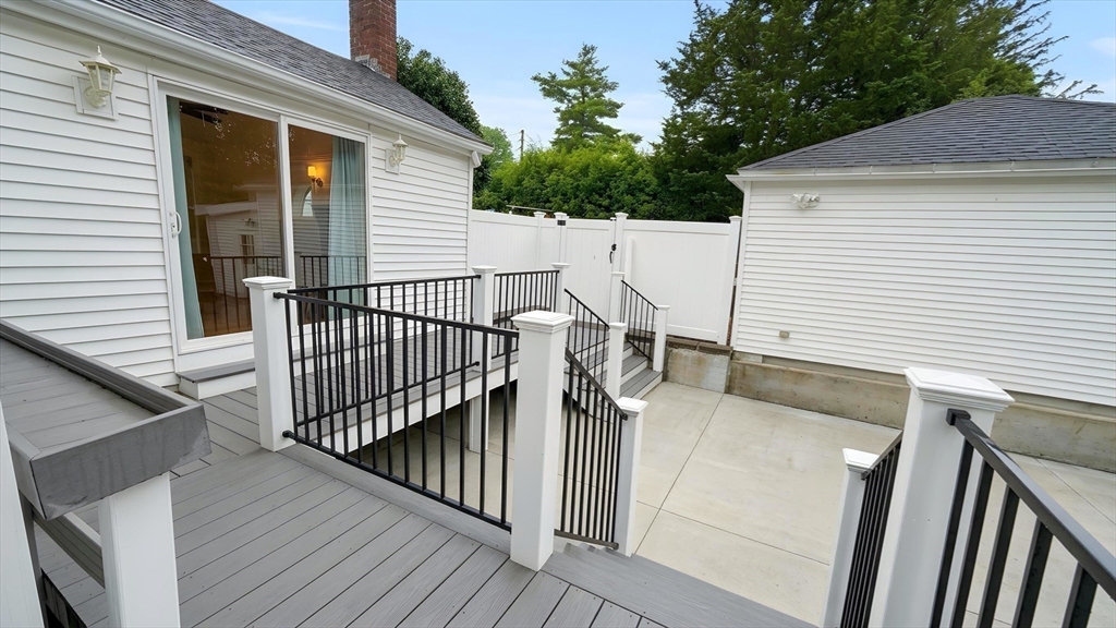 114 Curve Street Dedham, MA 02026 - Photo 23 of 27 a view of a balcony with wooden floor and fence