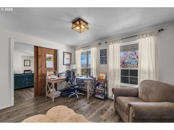 a living room with furniture and a window