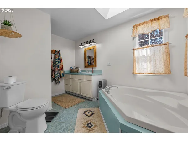 a bathroom with a sink a toilet and a bathtub