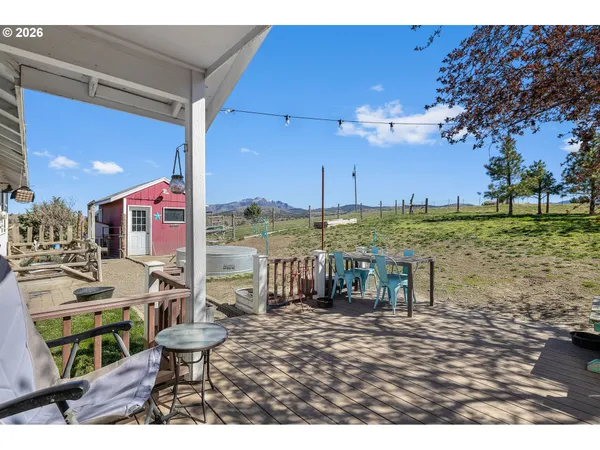 a dining room with furniture and a garden