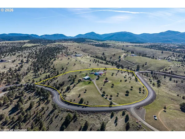 a view of a wooden house with a mountain