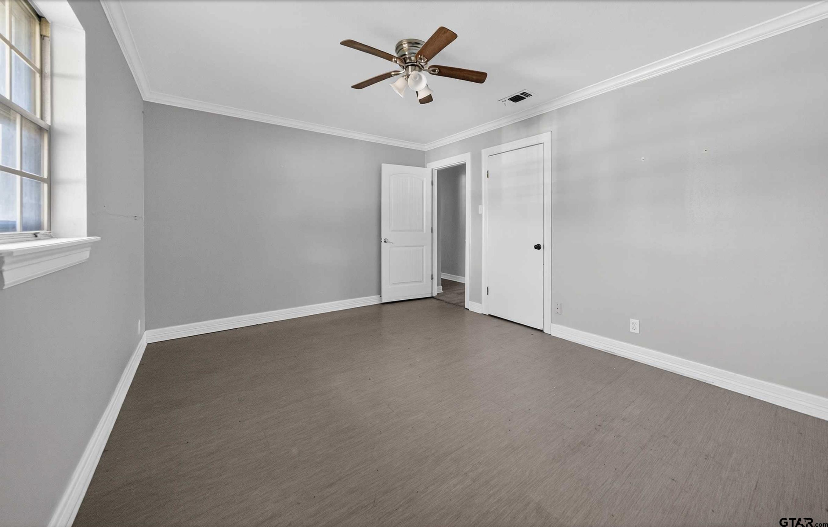 3408 Jackson Avenue Tyler, TX 75705 - Photo 44 of 45 a view of a ceiling fan in a room